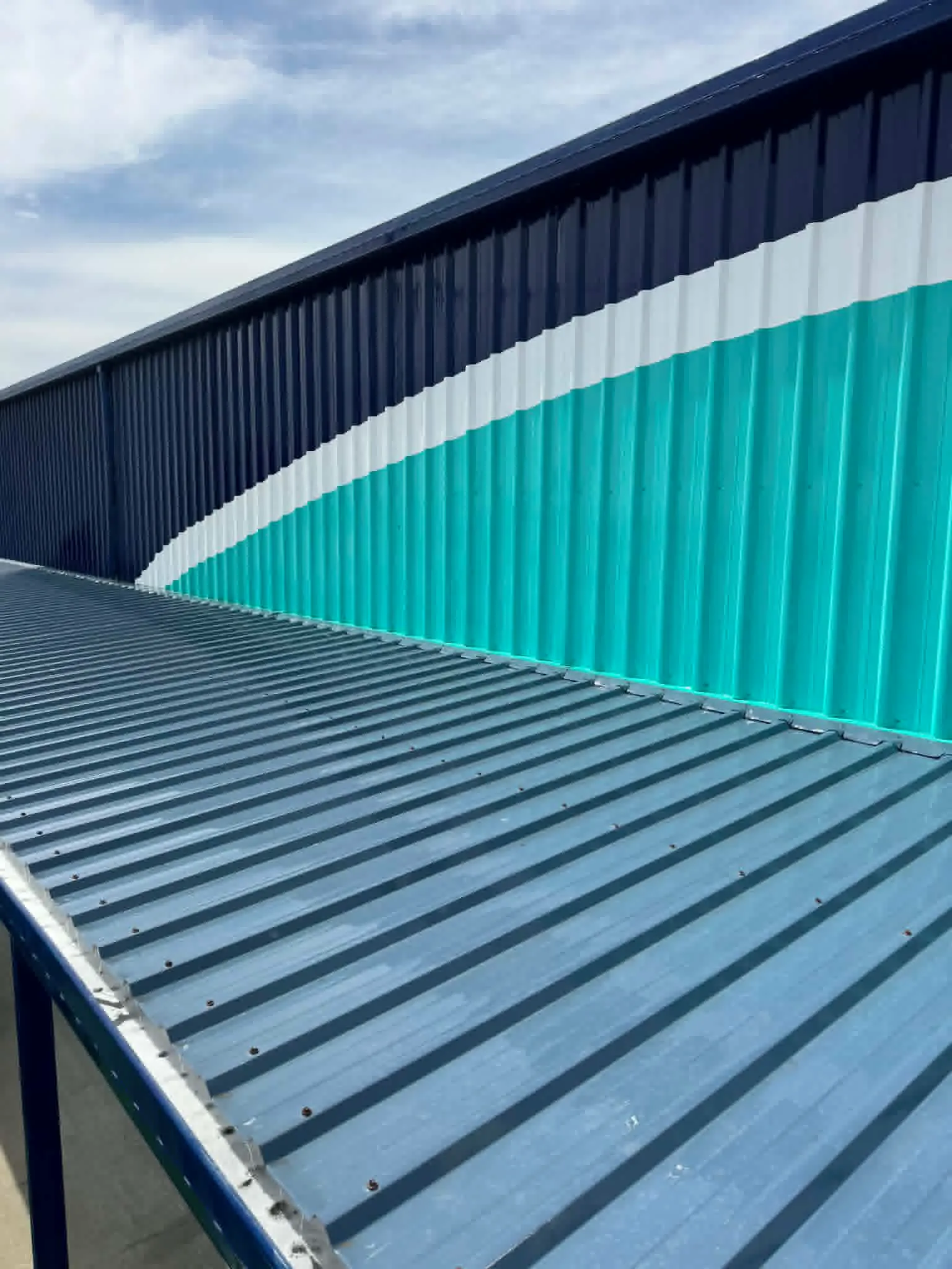 Commercial soft washing of a building exterior